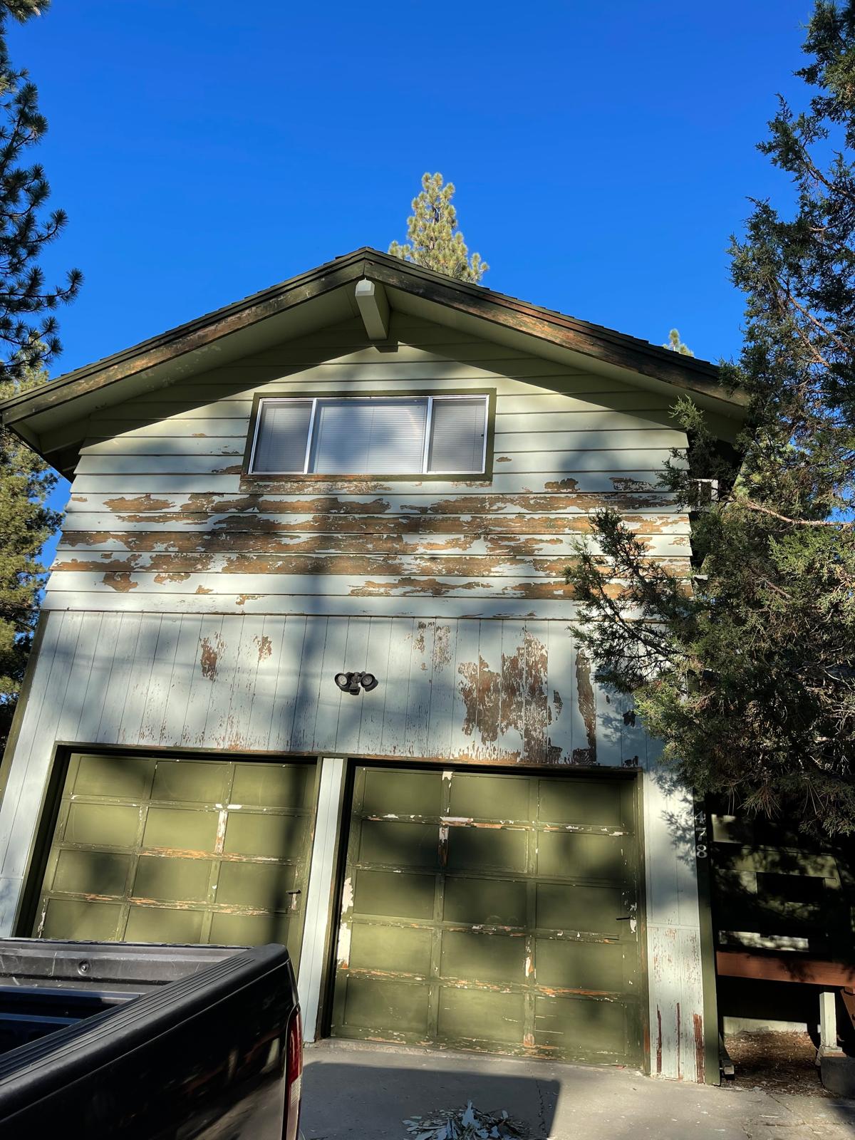 Home exterior before repaint, severely peeling paint