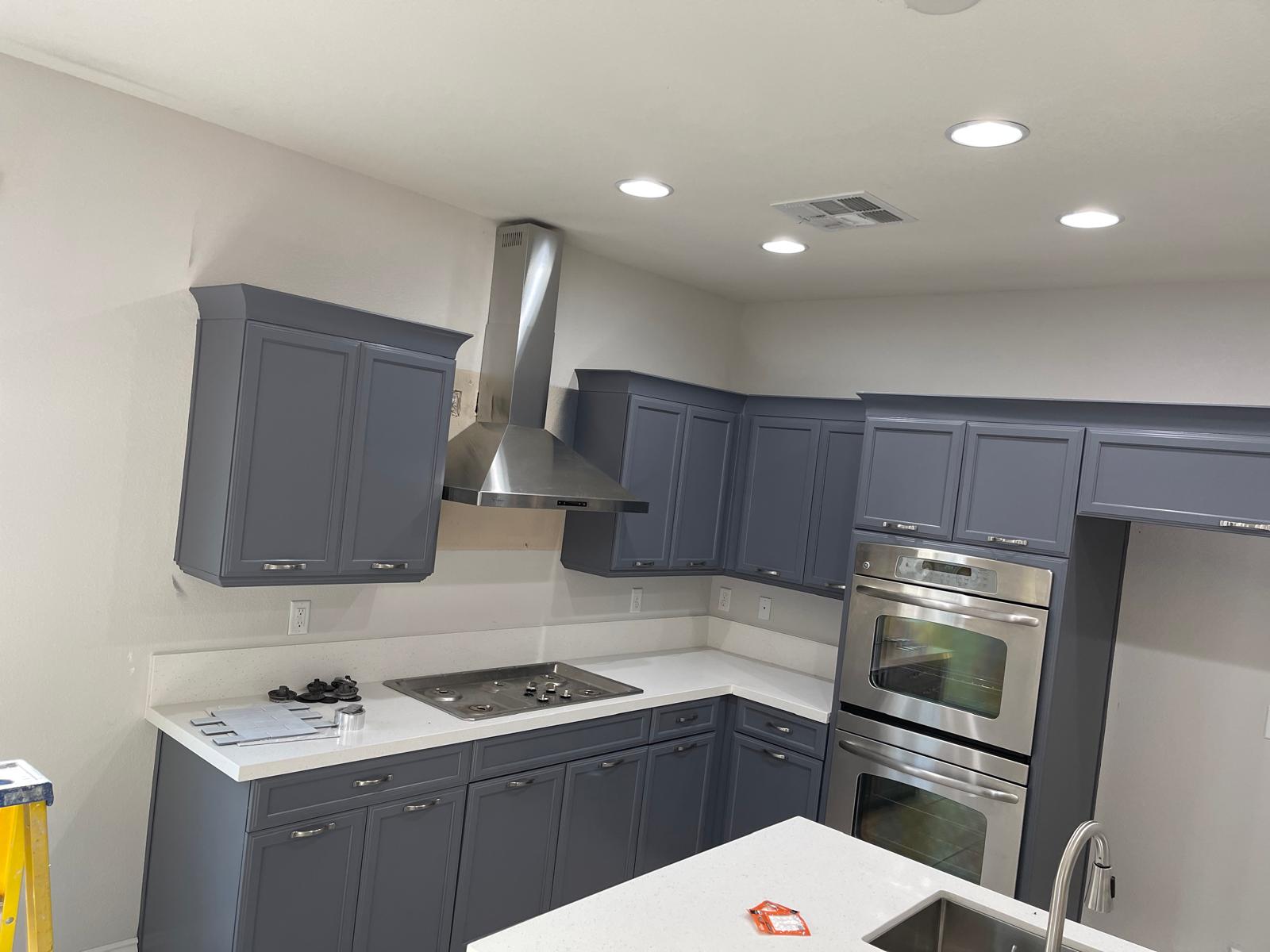 Kitchen cabinets after repaint, finished gray-blue