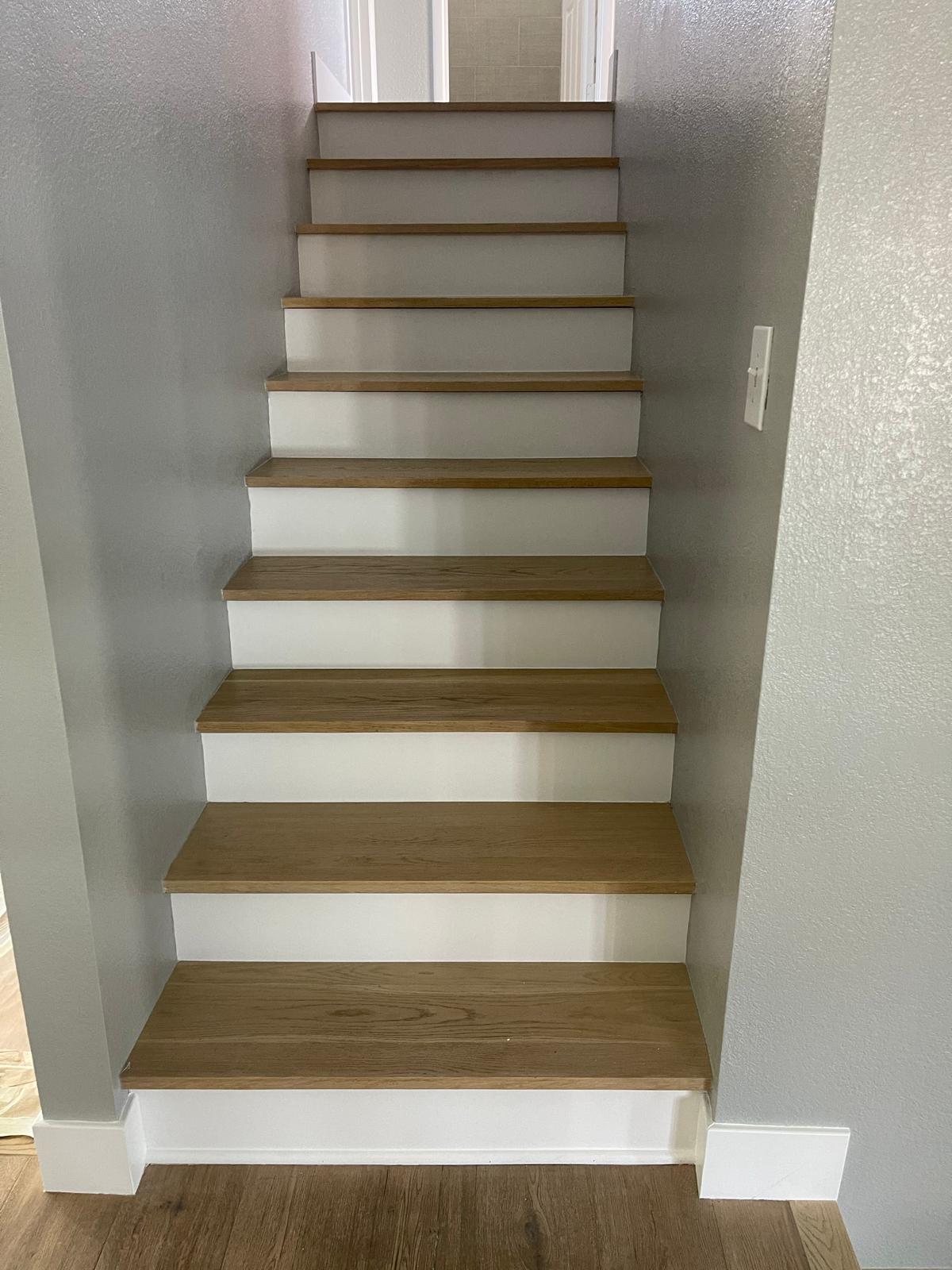 Custom staircase with light oak treads